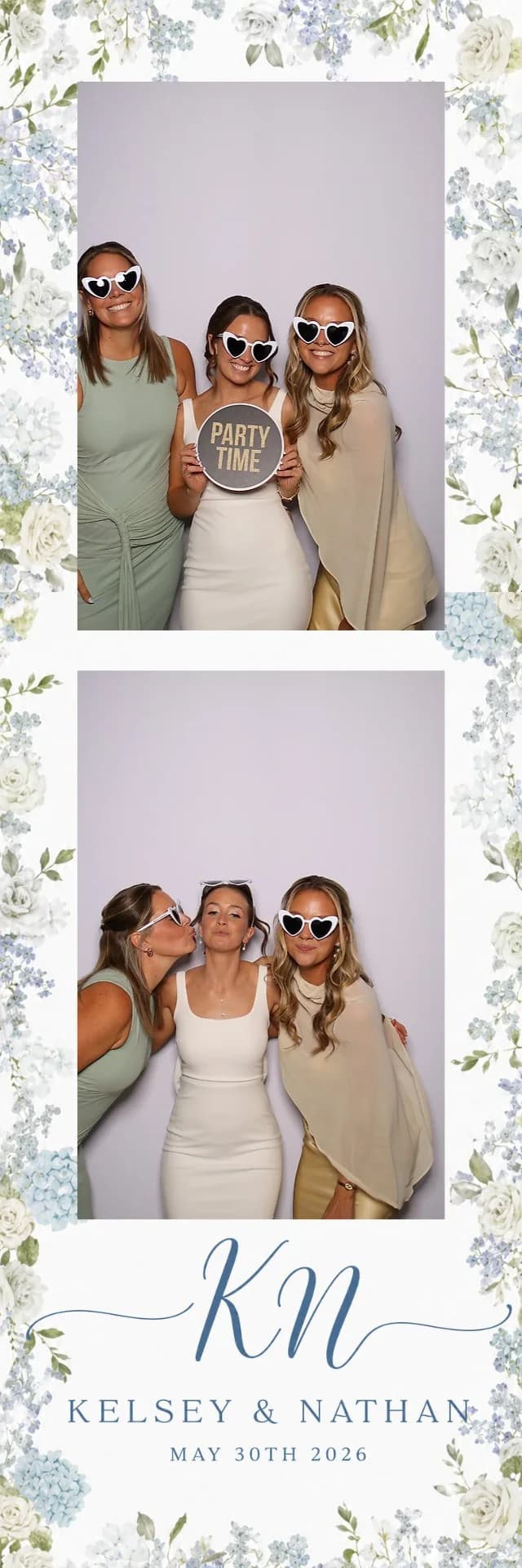 Three wedding guests posing in a custom floral photo booth strip