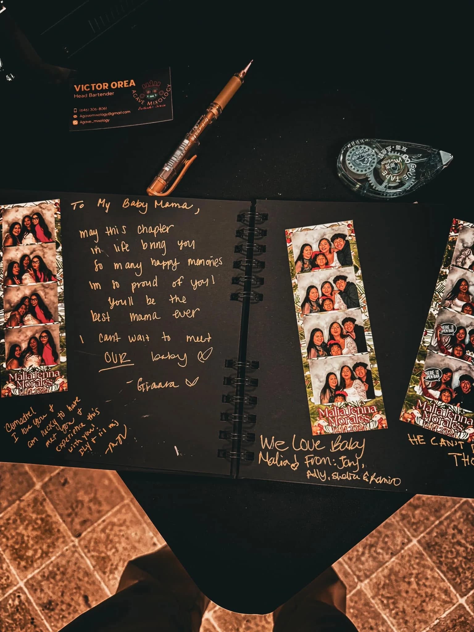 A black guestbook filled with photo strips and handwritten messages from event guests